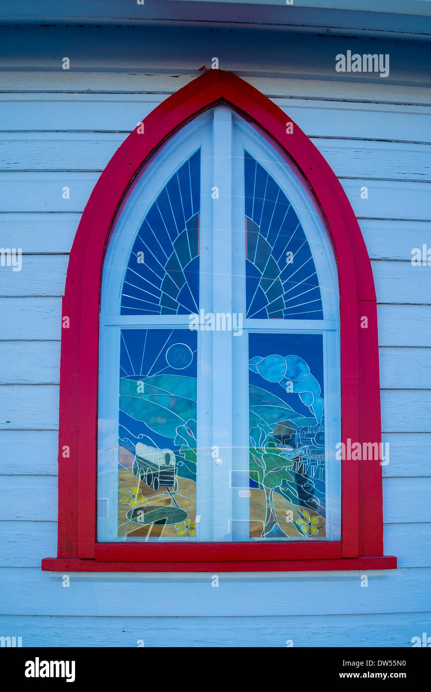 Stained glass window featuring covered wagon and steam locomotive, , St