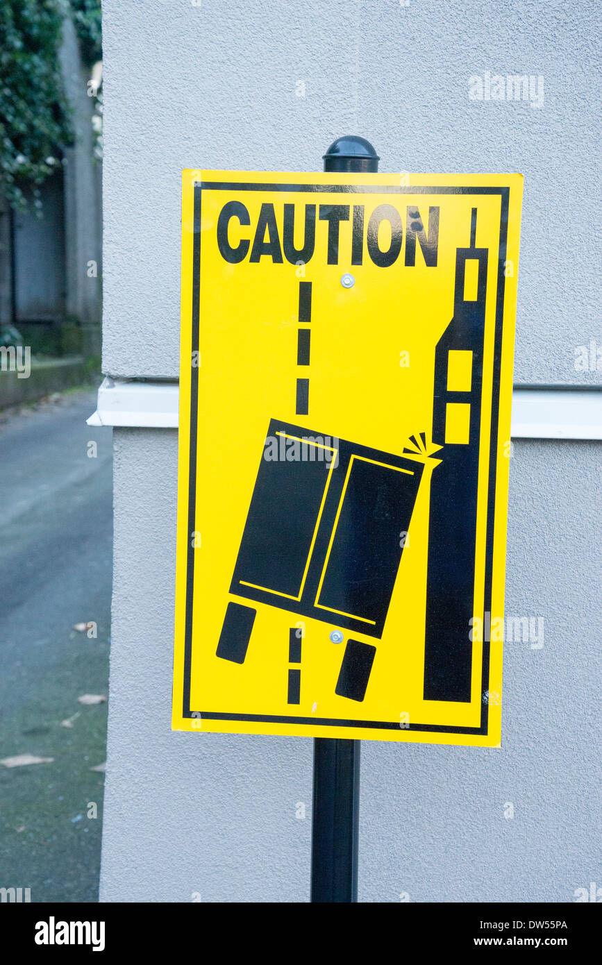 Caution sign. Truck in danger of hitting building. Stock Photo