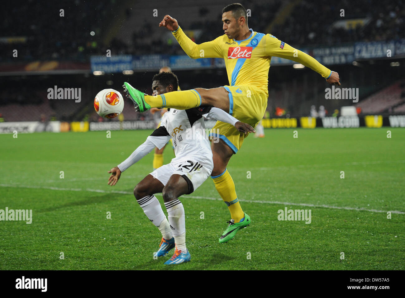 Naples, Italy. 27th Feb, 2014. Faouzi Ghoulam Chalenges Nathan Dyer during the UEFA Europa League Round of 32 Second Leg match between SSC Napoli and Swansea City Football / Soccer at Stadio San Paolo on February 27, 2014 in Naples, Italy. Credit:  Franco Romano/NurPhoto/ZUMAPRESS.com/Alamy Live News Stock Photo
