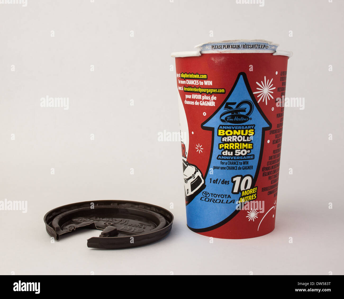 50th Anniversary Tim Horton's roll up the rim to win contest coffee cup with lid on white background Stock Photo