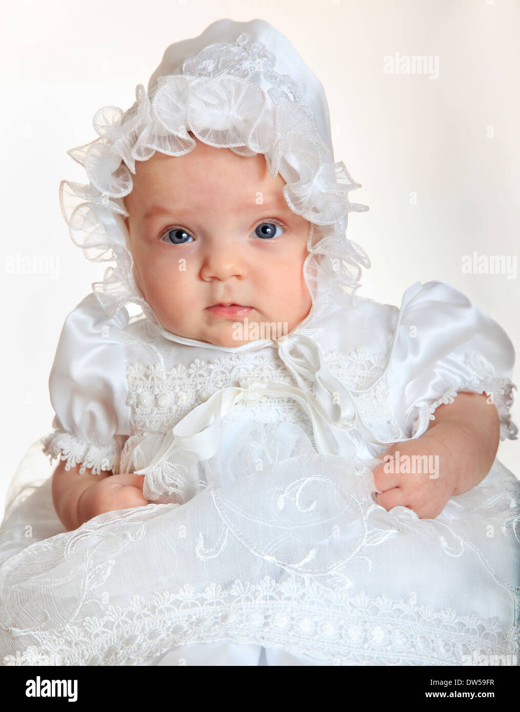 Baby girl portrait wearing a white suit and hat Stock Photo