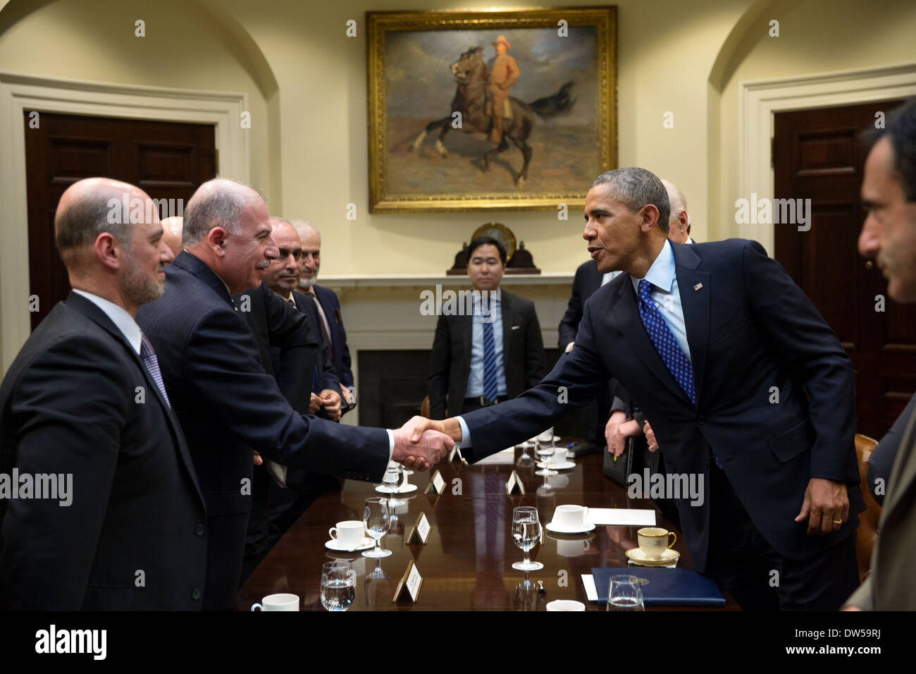 President Barack Obama greets Speaker Osama al-Nujaifi, Iraqi Council of Representatives, after he drops by Vice President Joe Biden's meeting with the Speaker in the Roosevelt Room of the White House, Jan. 22, 2014. Stock Photo