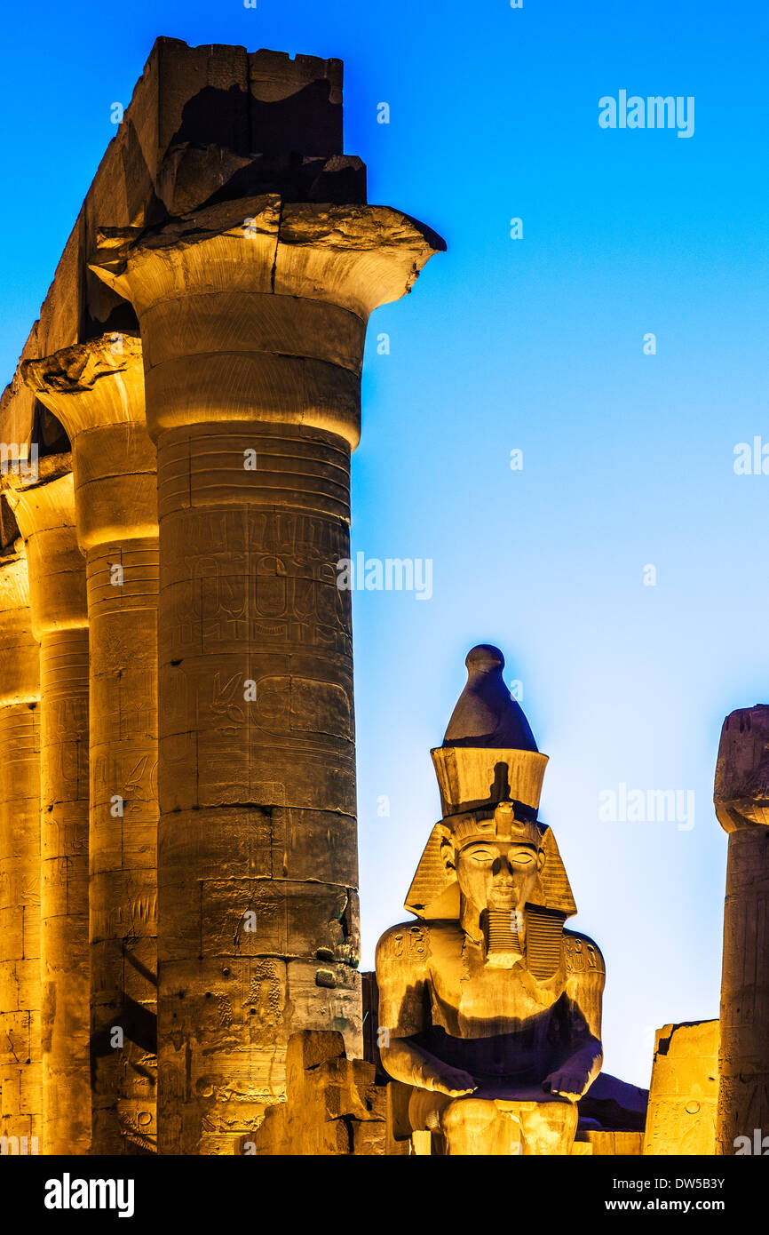 Statue of Ramesses II (originally Tutankhamen) and the papyrus columns of the central colonnade of Amenhotep III, Luxor Temple. Stock Photo