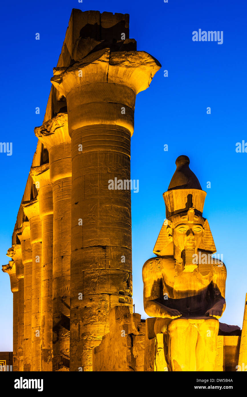 Statue of Ramesses II (originally Tutankhamen) and the papyrus columns of the central colonnade of Amenhotep III, Luxor Temple. Stock Photo