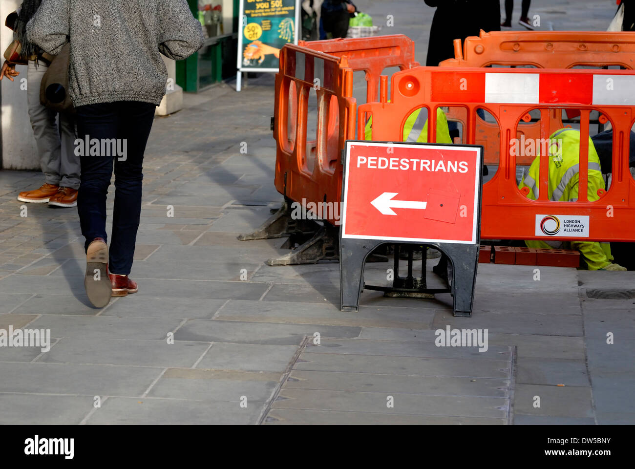 London, England, UK. Pedestrian diversion sign at roadworks Stock Photo