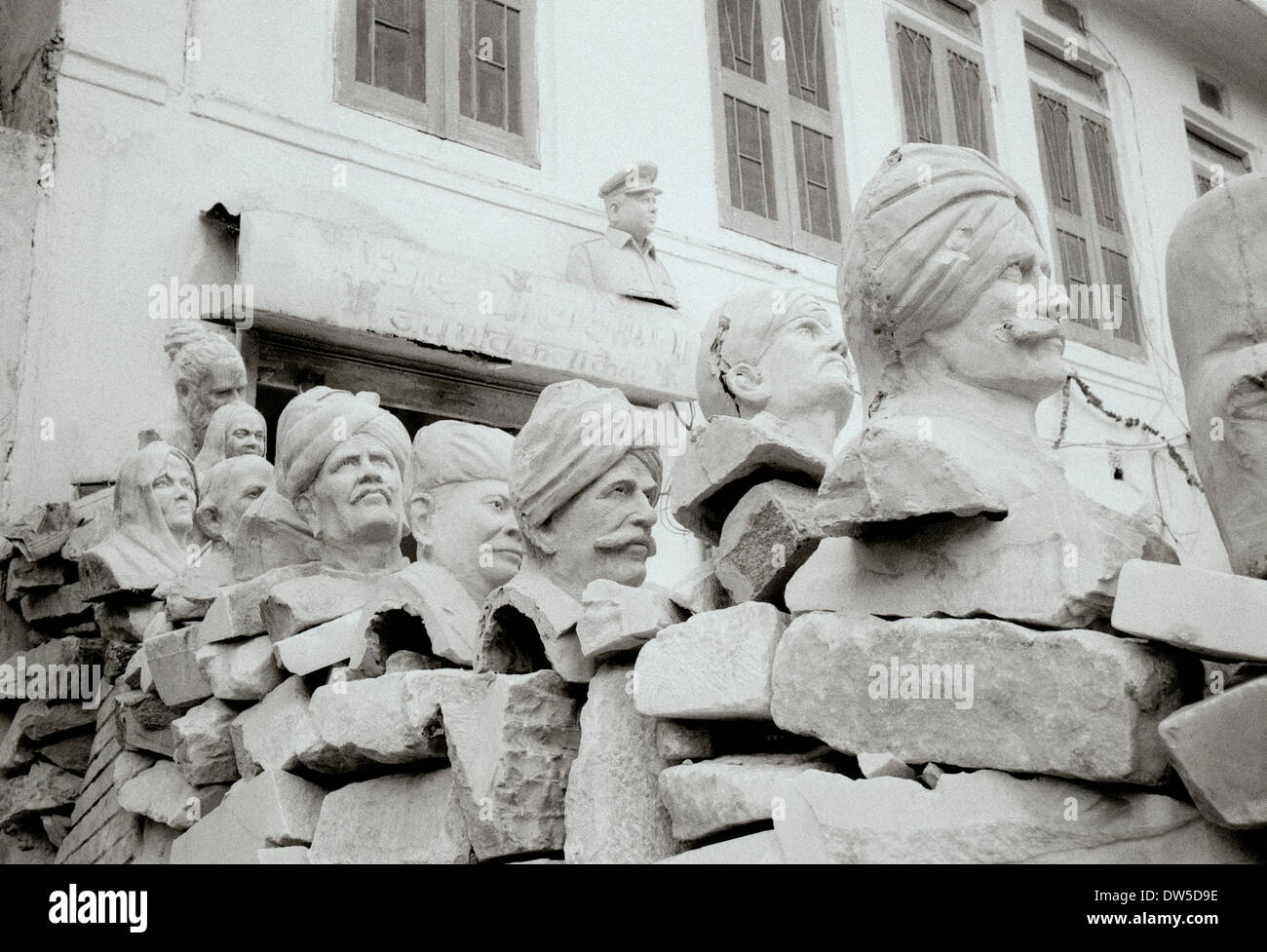 Travel Photography - Street scene of stonemason heads in Jaipur in Rajasthan in India in South Asia. Art Stone Bizarre Reportage Documentary Stock Photo