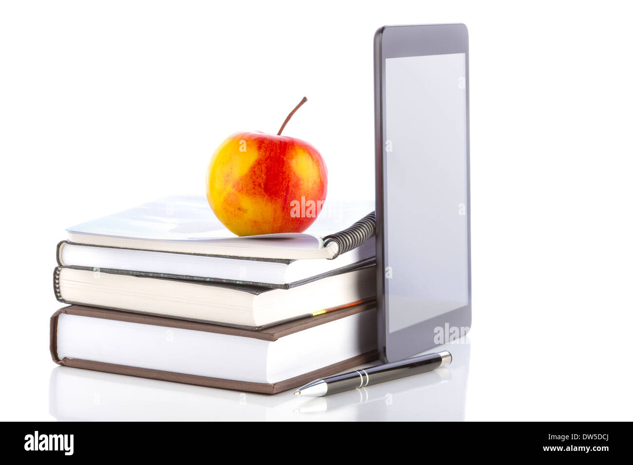 Concept of online education. Tablet pc with school and office supplies. Stock Photo