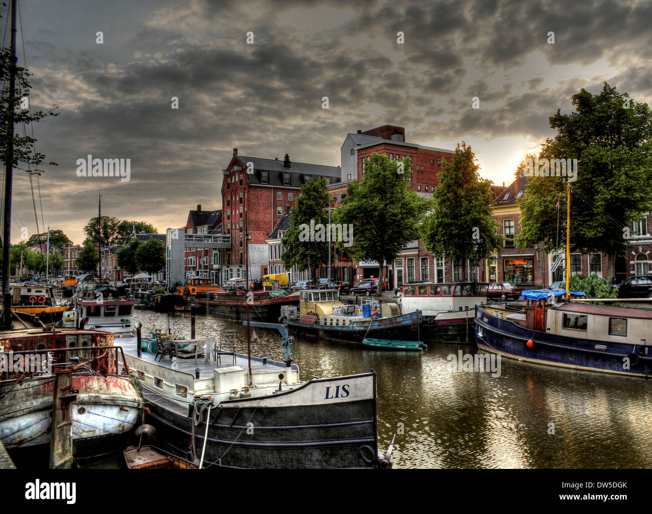 Warehouses and sailing ships along the canals at Noorderhaven (Northern Harbour) in Groningen, The Netherlands, HDR-edit Stock Photo