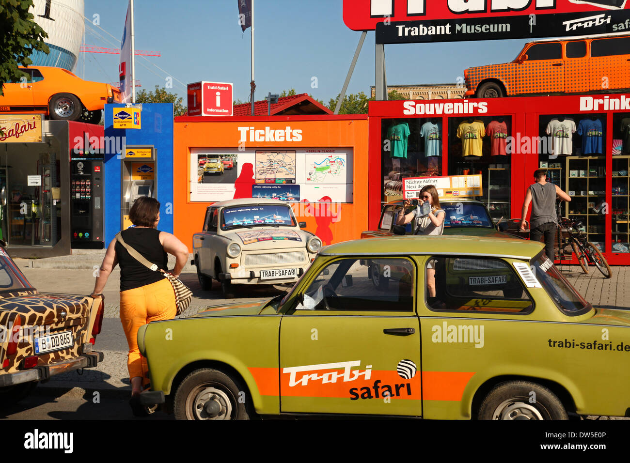 Tourists stand at an East German Trabant car near Checkpoint Charlie in Berlin, September 06, 2013. More and more tourists come to the German capital every year. The photo is part of a series on tourism in Berlin. Photo. Wolfram Steinberg dpa Stock Photo