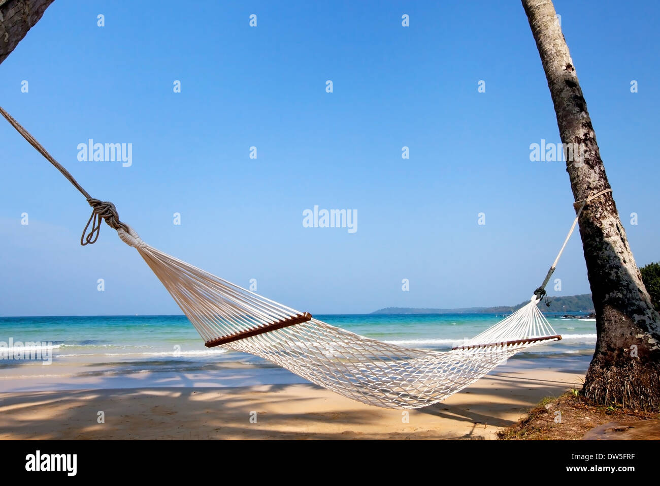 vacations, hammock on paradise beach Stock Photo