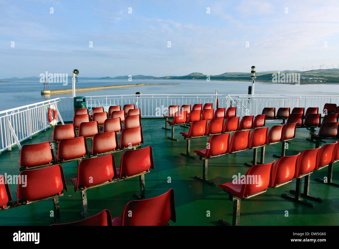 Red seats on the Caledonian MacBrayne Ardrossan to Brodick Arran Ferry leaving Ardrossan, Ayrshire Stock Photo