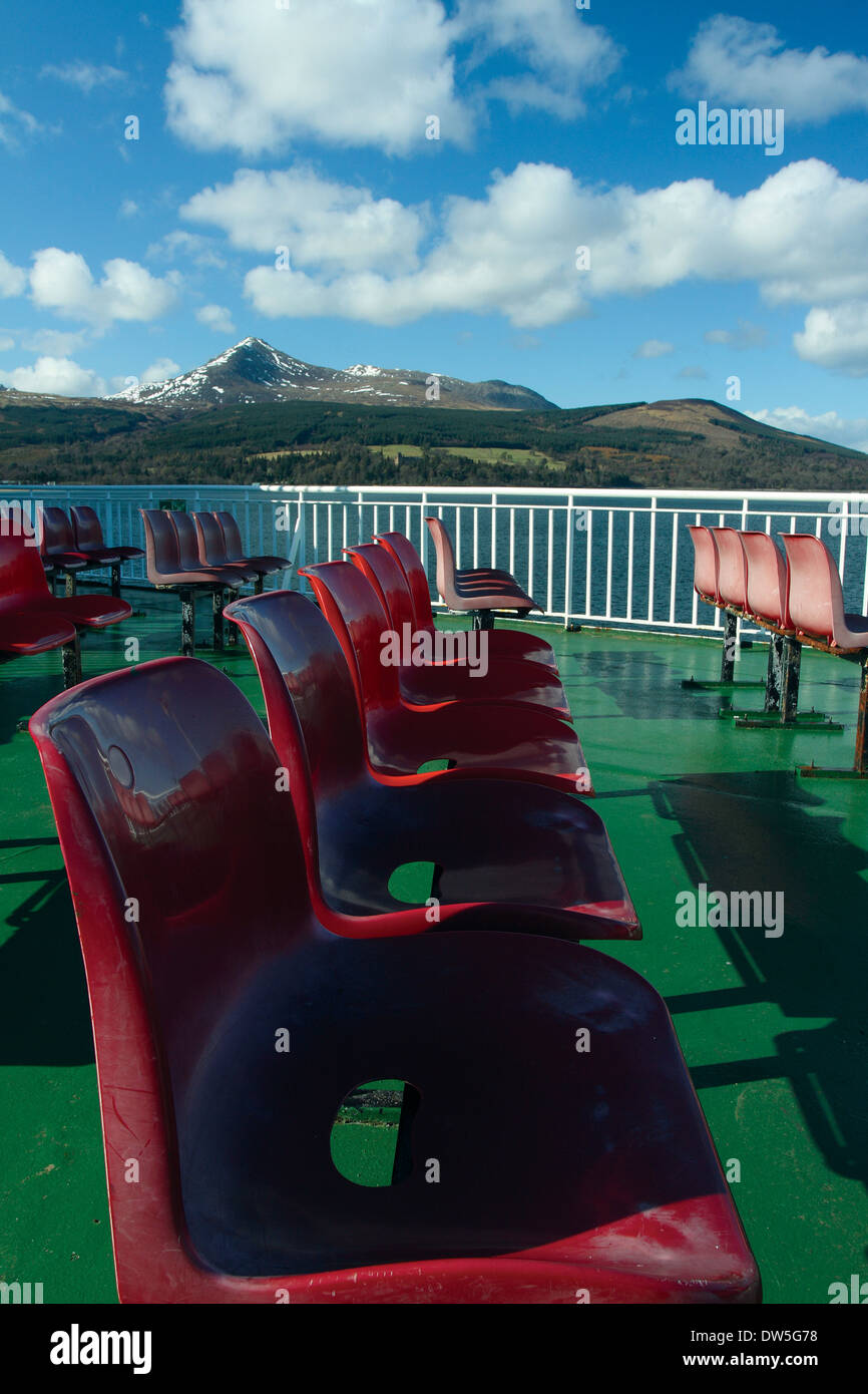Red seats on the Caledonian MacBrayne Ardrossan to Brodick Arran Ferry approaching Brodick, Arran, Ayrshire Stock Photo