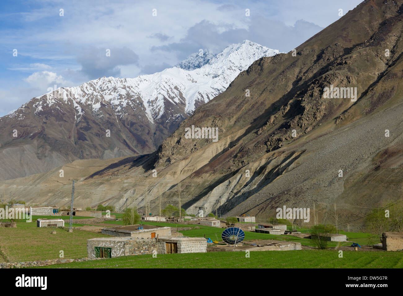 Large satellite dish outside of a house in the village of Teru, in the Ghizar River (Gilgit River) Valley, seen from the Shandur-Gilgit Road, near the Shandur Pass, Gilgit-Baltistan, Pakistan Stock Photo