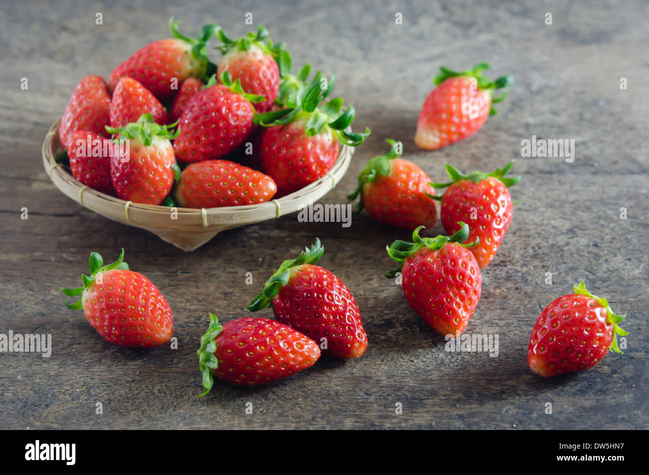Fresh strawberries on basket , over old wooden background Stock Photo ...