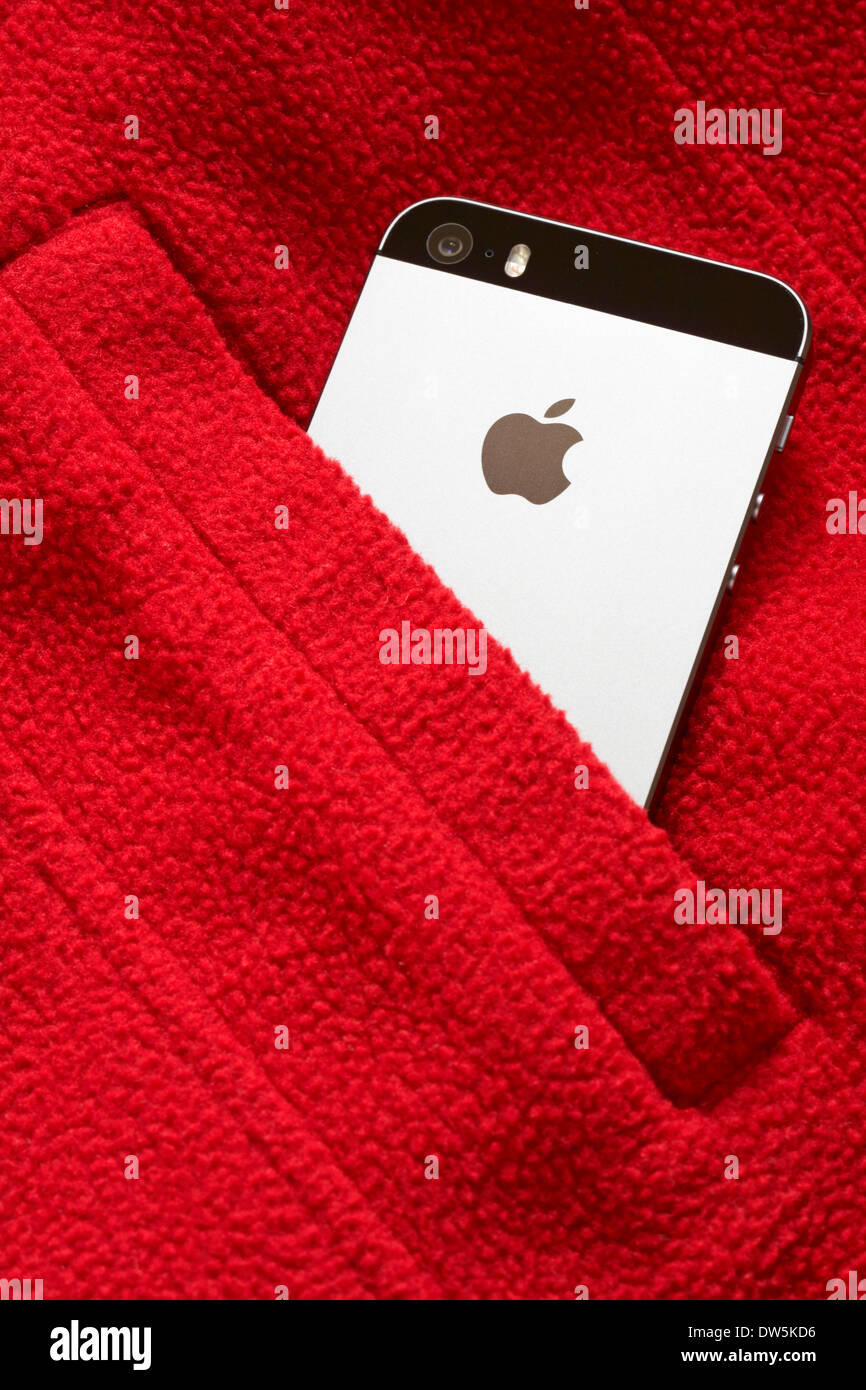 Apple logo on back of Iphone 5S in pocket Stock Photo