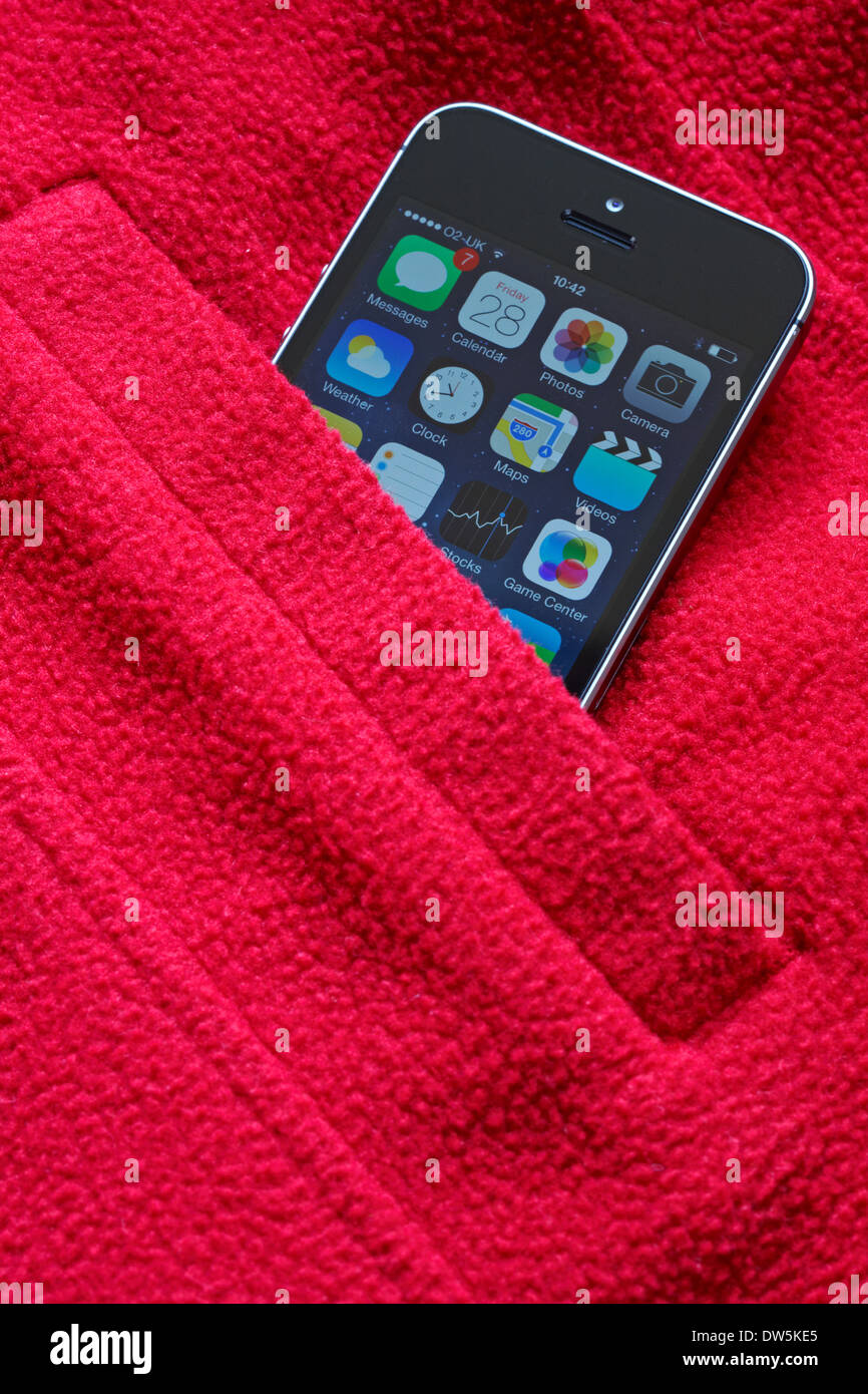 Iphone 5s in pocket of red jacket Stock Photo