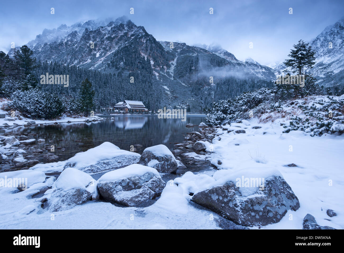 Popradske Pleso lake and mountain cottage in wintertime, Slovakia, Europe. Stock Photo