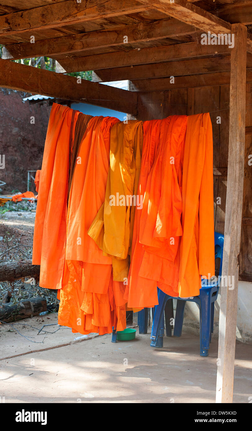 Buddhist Monks robes hanging out to dry at temple in Huay Pakoot village, Thailand. Stock Photo