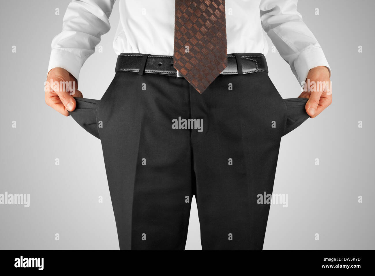 bankrupt business man showing empty pockets hands Stock Photo