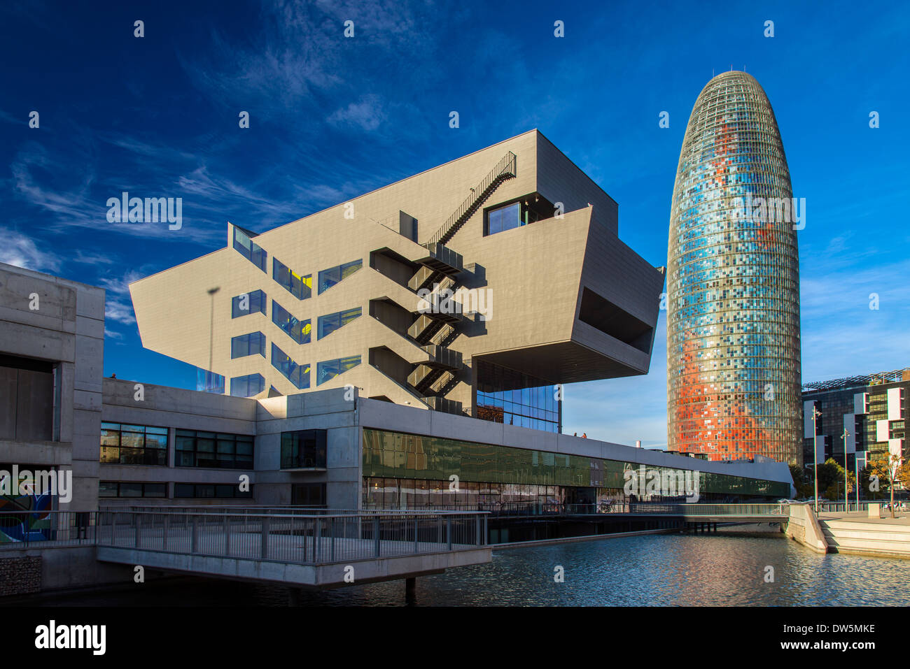 Design Museum or Museu del Disseny with Torre Agbar behind at night, Barcelona, Catalonia, Spain Stock Photo
