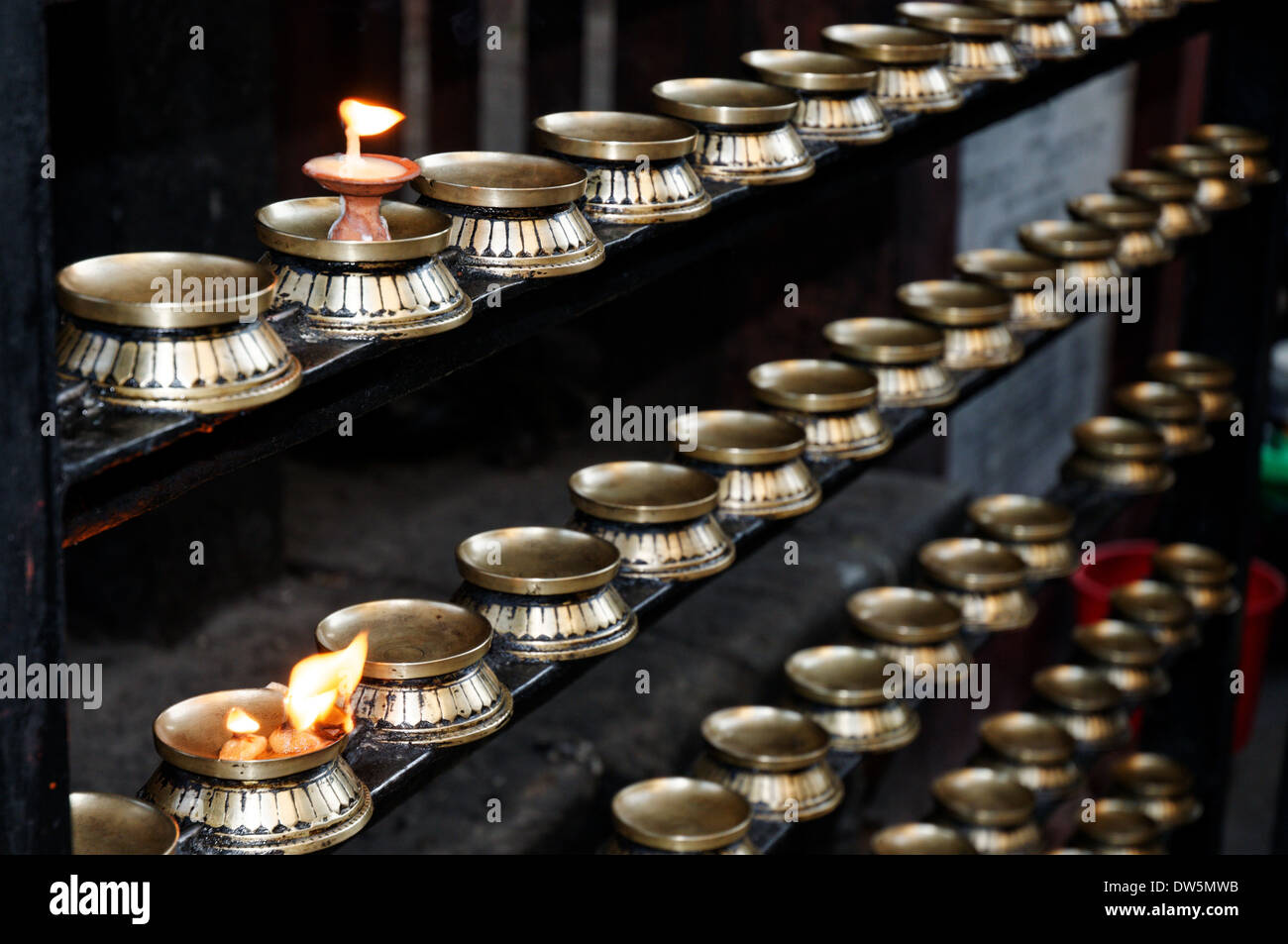 Rows of candles in a Hindu temple in Nepal Stock Photo Alamy