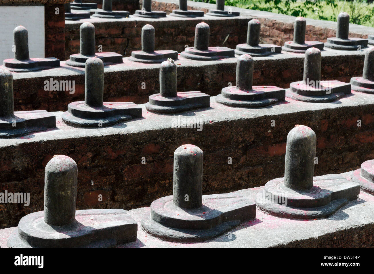 Phallic symbols (linga) in a temple devoted to Shiva in Nepal Stock Photo