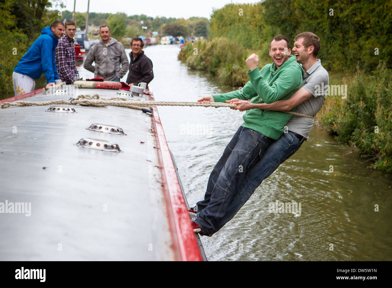 A group of men on a stag weekend on a narrowboat Stock Photo