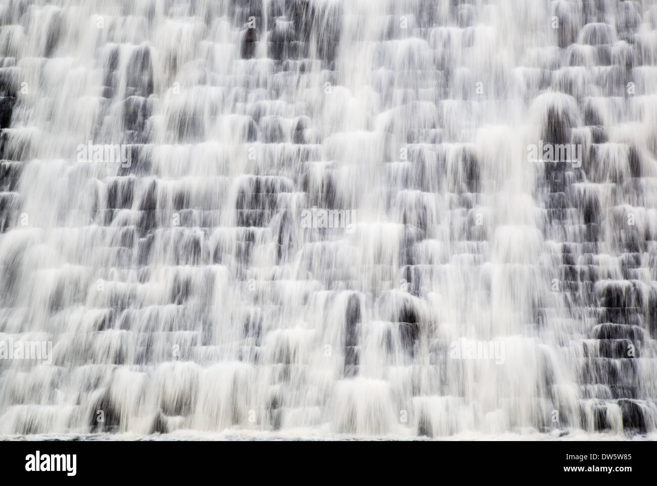 Water cascading down the dam wall at Derwent reservoir after months of heavy rain in the Derbyshire Peak District Stock Photo