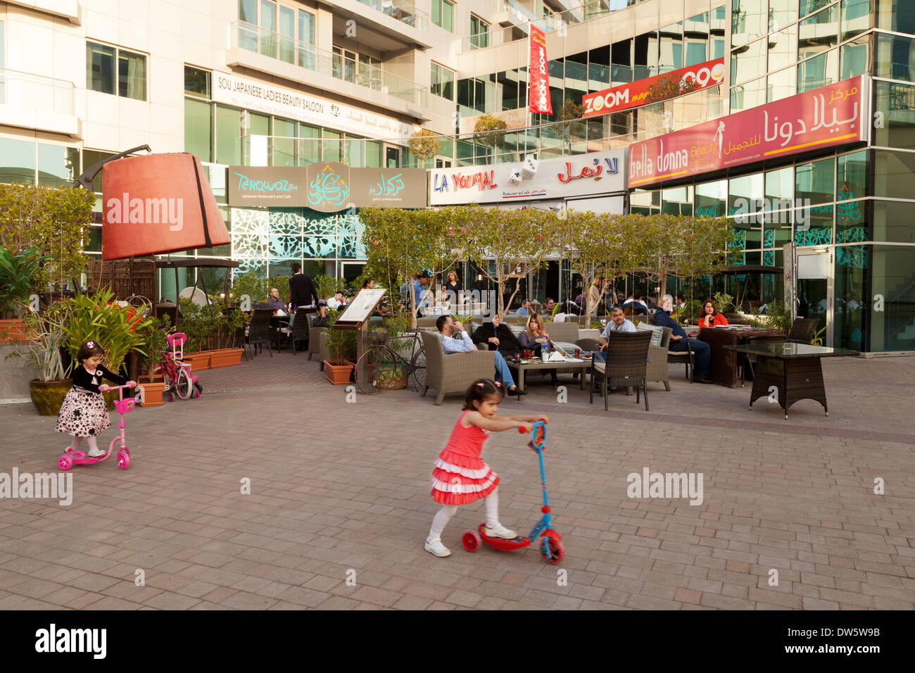 Children playing outside Lebanese restaurants and shops, The Walk,  Jumeirah, Dubai UAE, United Arab Emirates Middle East Stock Photo - Alamy