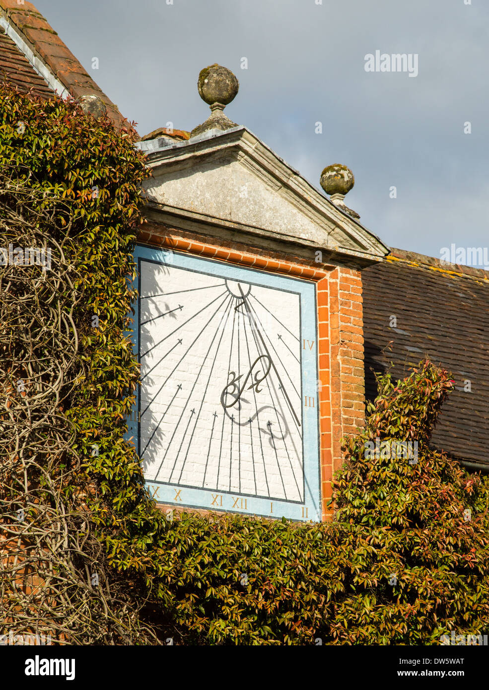 Sundial clock on the walls of Packwood House in Worcestershire Stock Photo