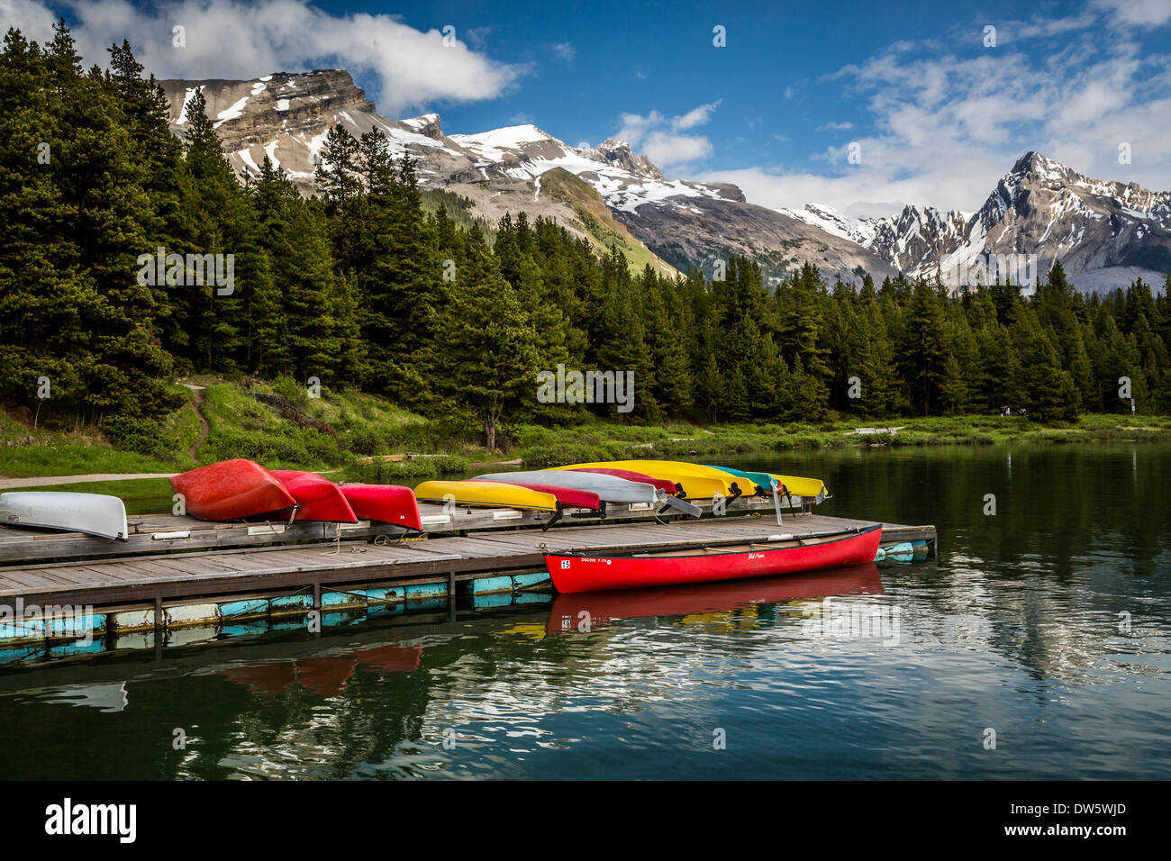 Colorful canoes at the dock at the Maligne Lake boat dock in Jasper
