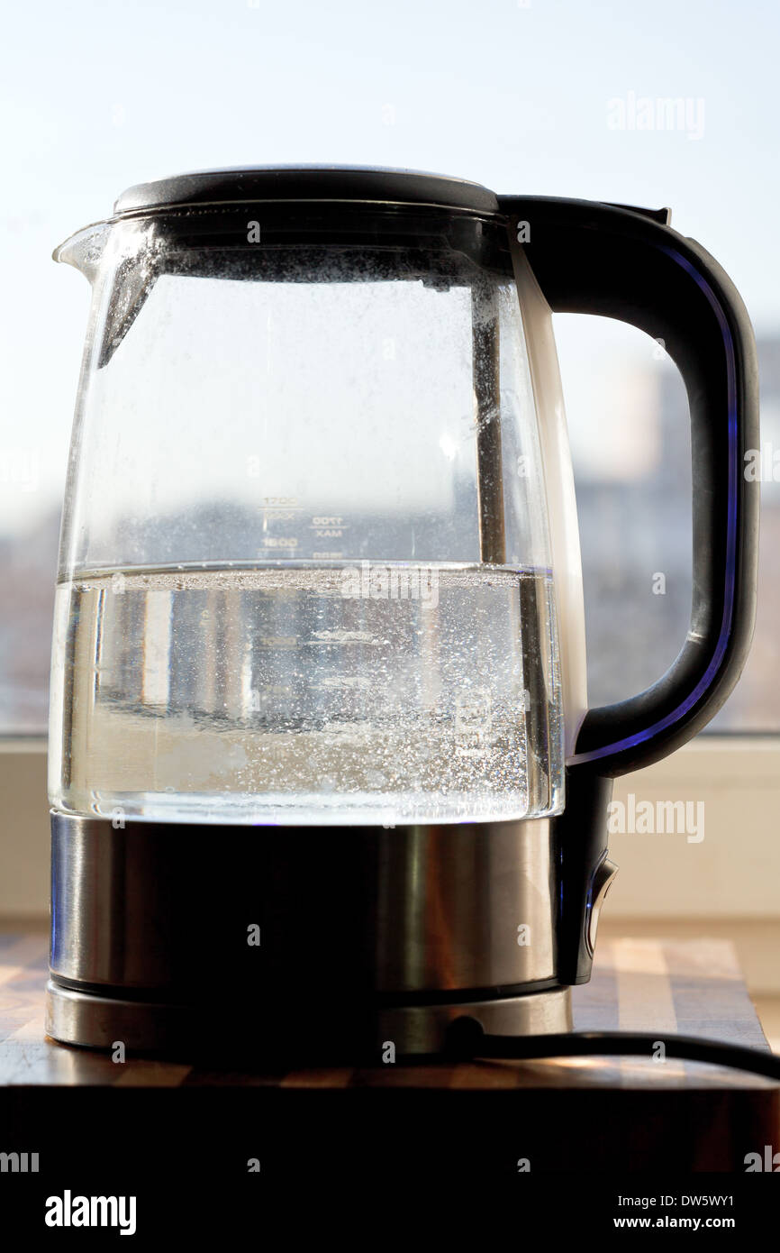 electric kettle with boiling water in home kitchen Stock Photo