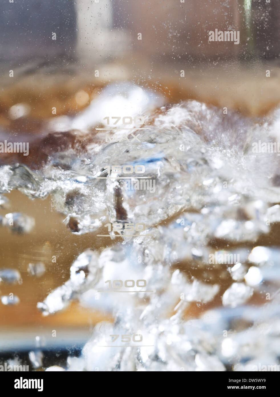 hot boiling water in glass kettle close up Stock Photo
