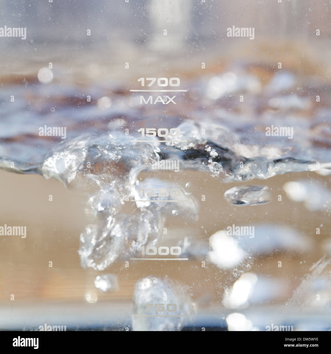 bubbles boiling water in electric kettle close up Stock Photo