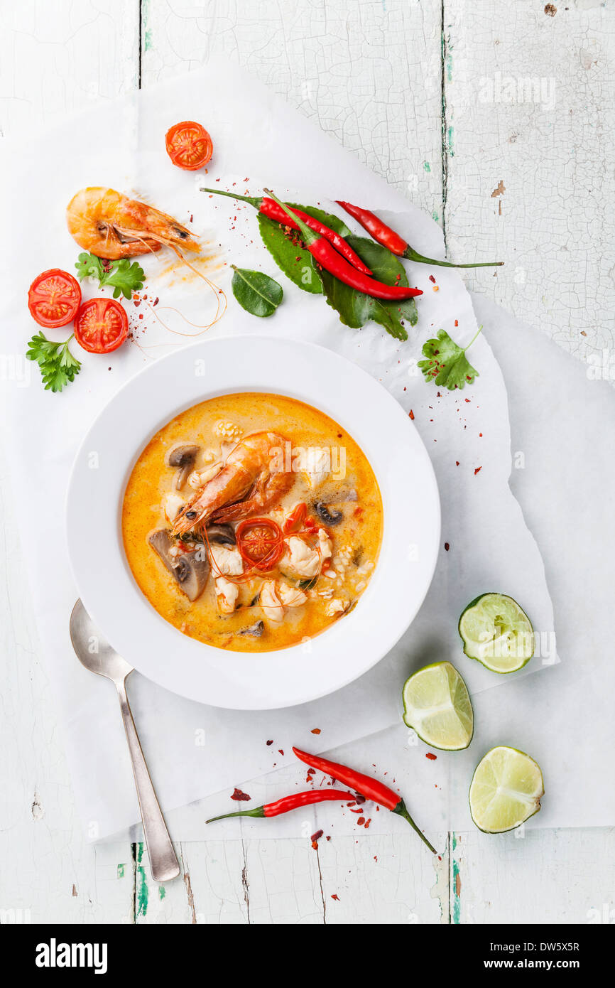Spicy Thai soup Tom Yam with Coconut milk, Chili pepper and Seafood