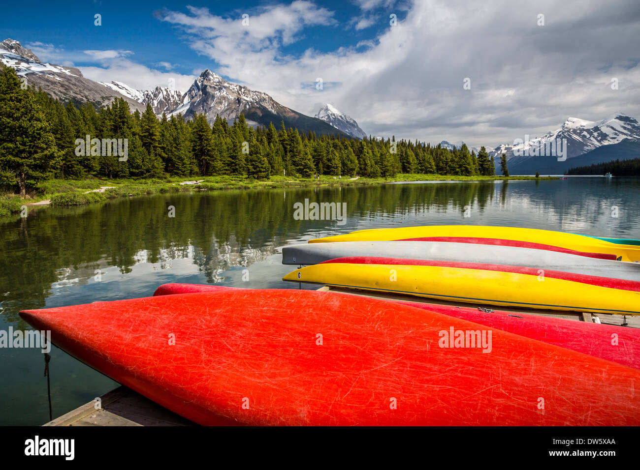 Colorful canoes at the dock at the Maligne Lake boat dock in Jasper