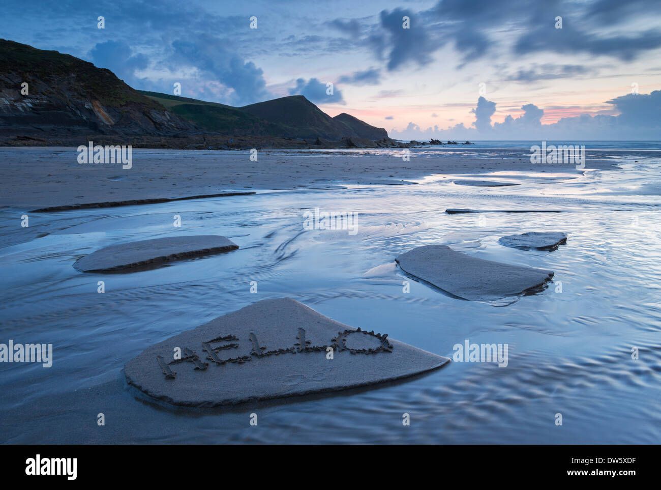 A welcome message left in the sand on Crackington Haven Beach, Cornwall, England. Summer (August) 2013. Stock Photo