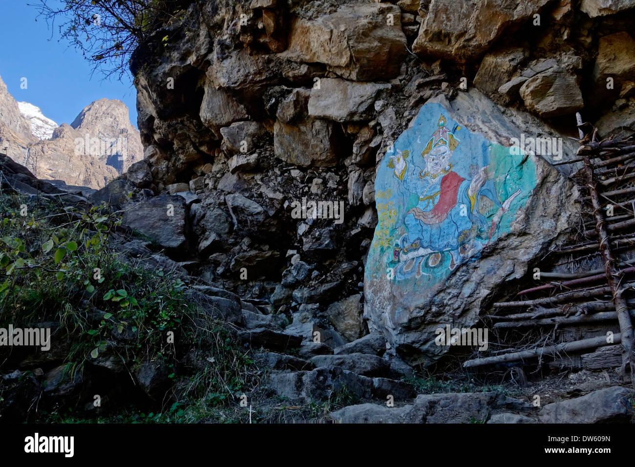 Painted boulder in the Mansslu region of Nepal. Stock Photo
