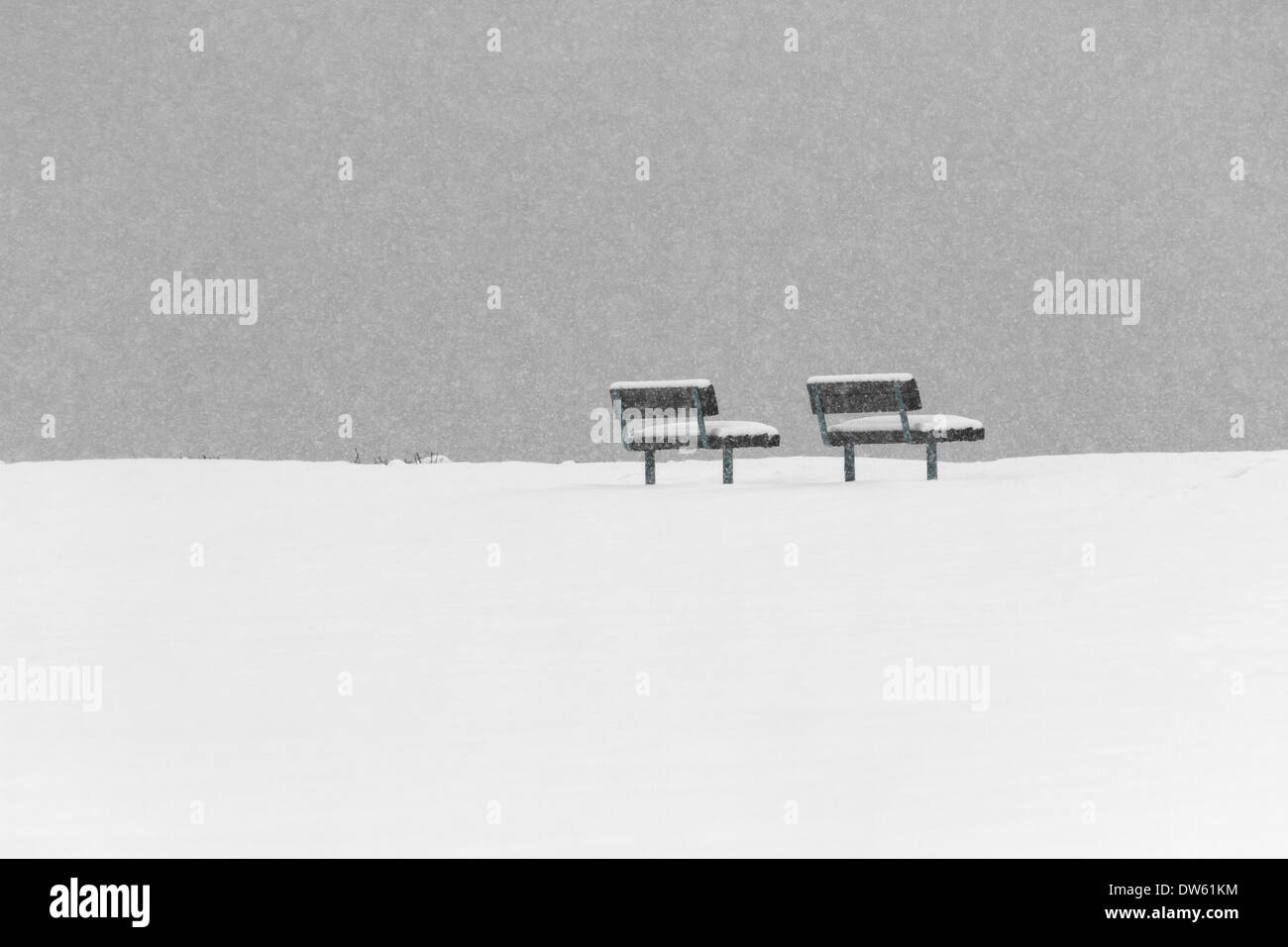 Bench in Winter, snowing Stock Photo