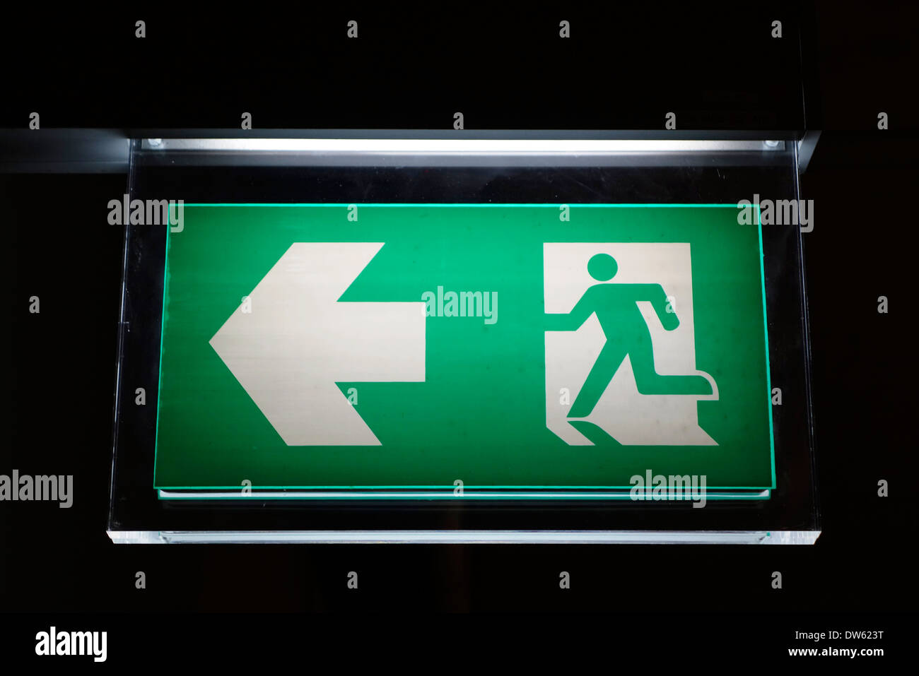 Emergency exit sign in the Suvarnabhumi Airport, Bangkok, Thailand. Stock Photo