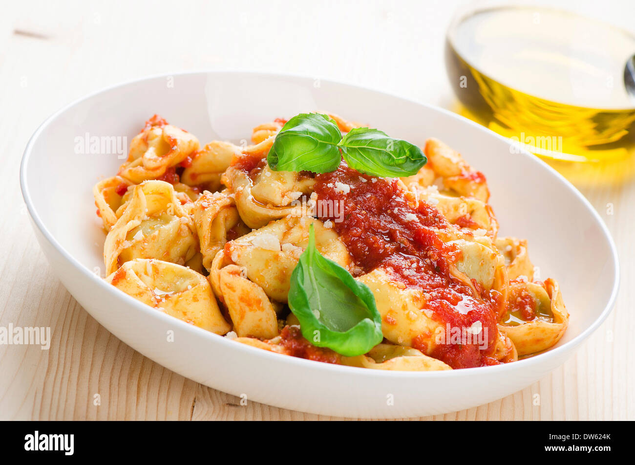Tortellini with tomato sauce and cheese Stock Photo Alamy