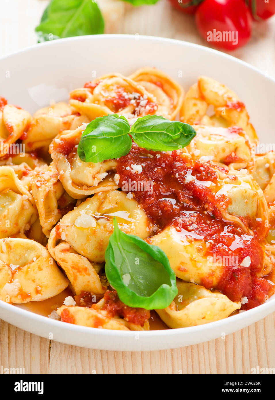 Tortellini with tomato sauce and cheese Stock Photo