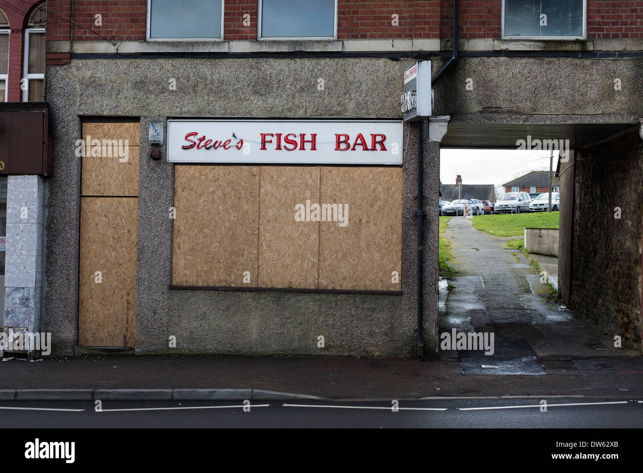 A boarded-up fish and chip shop in Wellingborough, Northamptonshire. Stock Photo