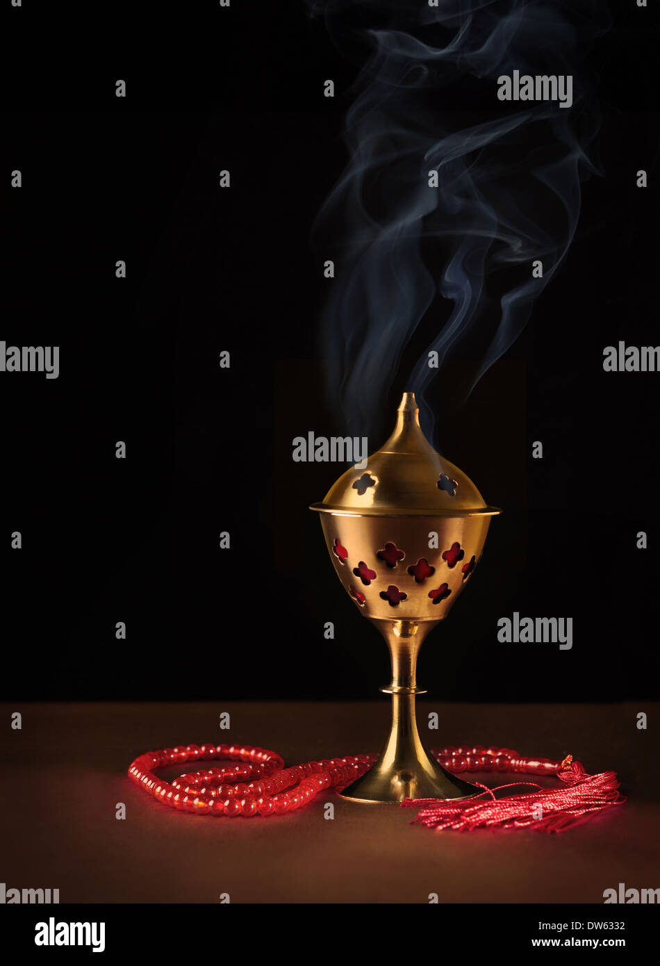 Traditional Arabic Oud burner with Islamic prayer beads. Aromatic