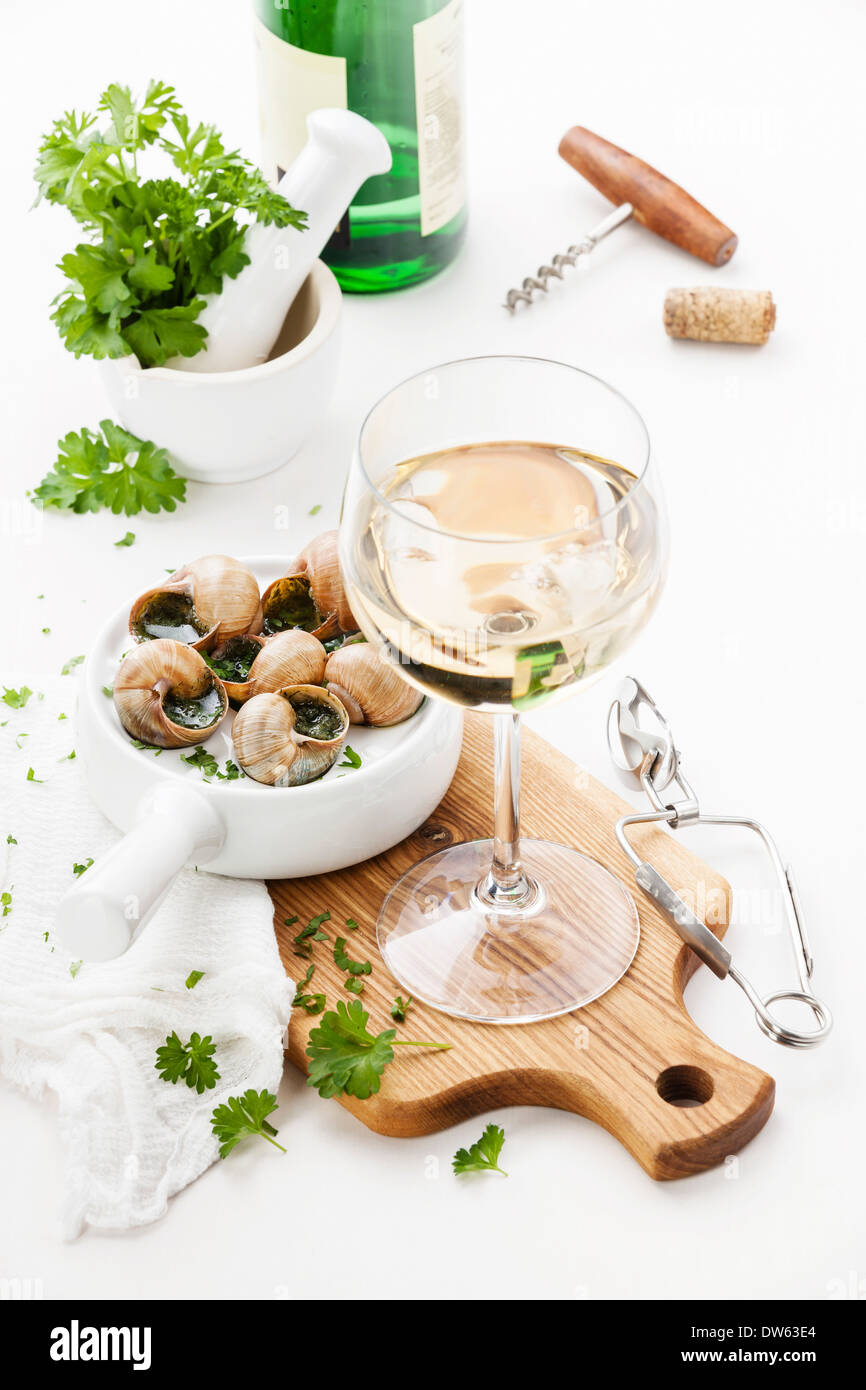 Baked snails with garlic butter sauce and wine Stock Photo Alamy