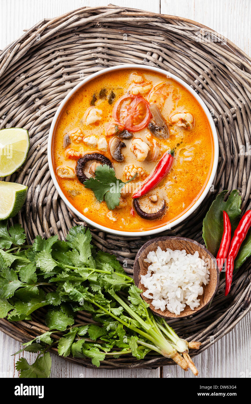 Spicy Thai soup Tom Yam with Coconut milk, Chili pepper and Seafood Stock Photo