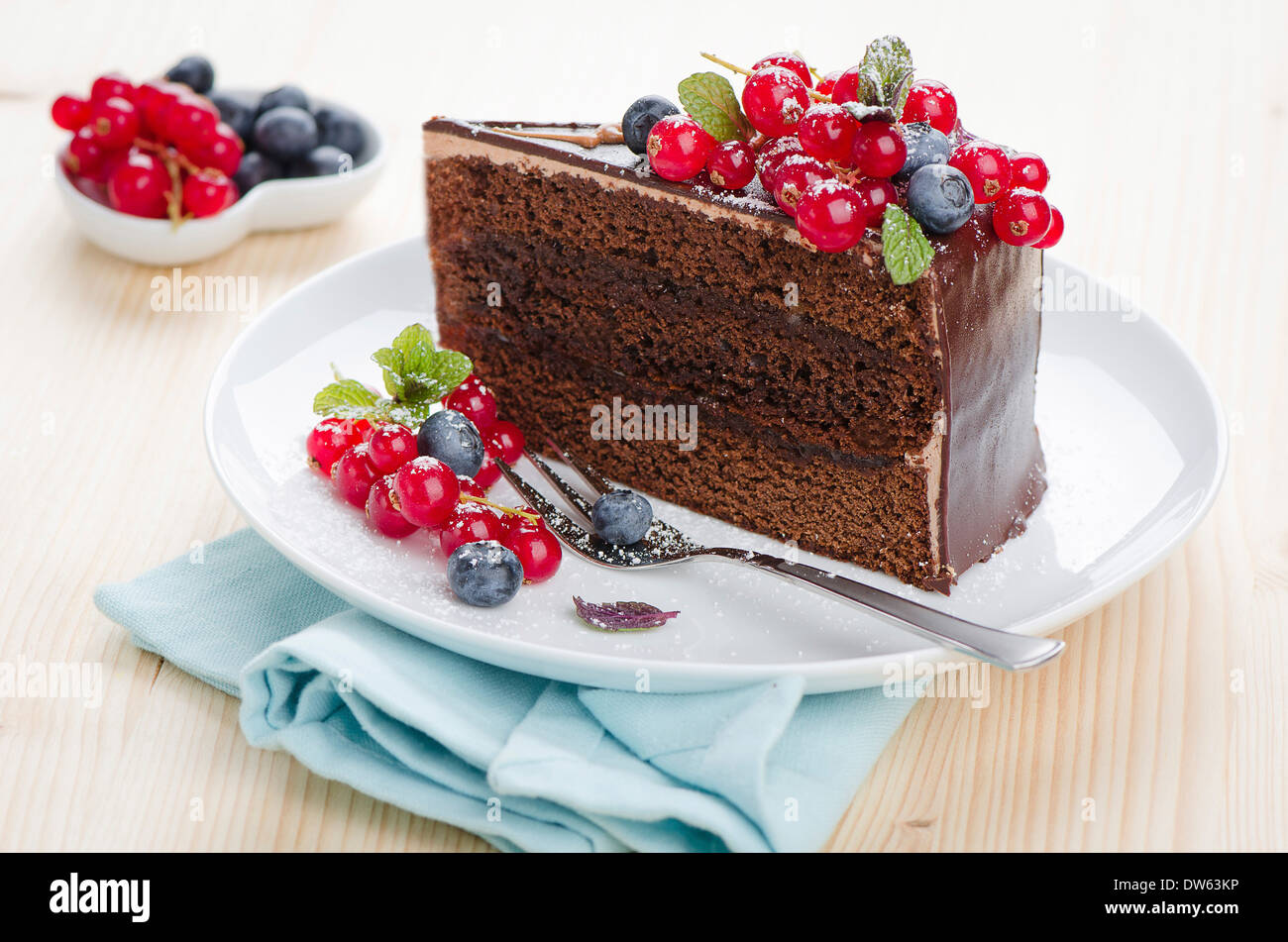 Sacher cake on a plate with berries Stock Photo