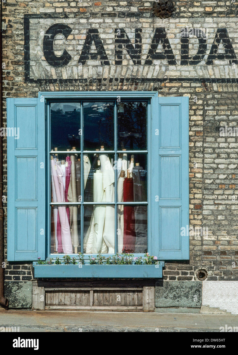 front facade of fabric store in Old Quebec City with hand painted sign