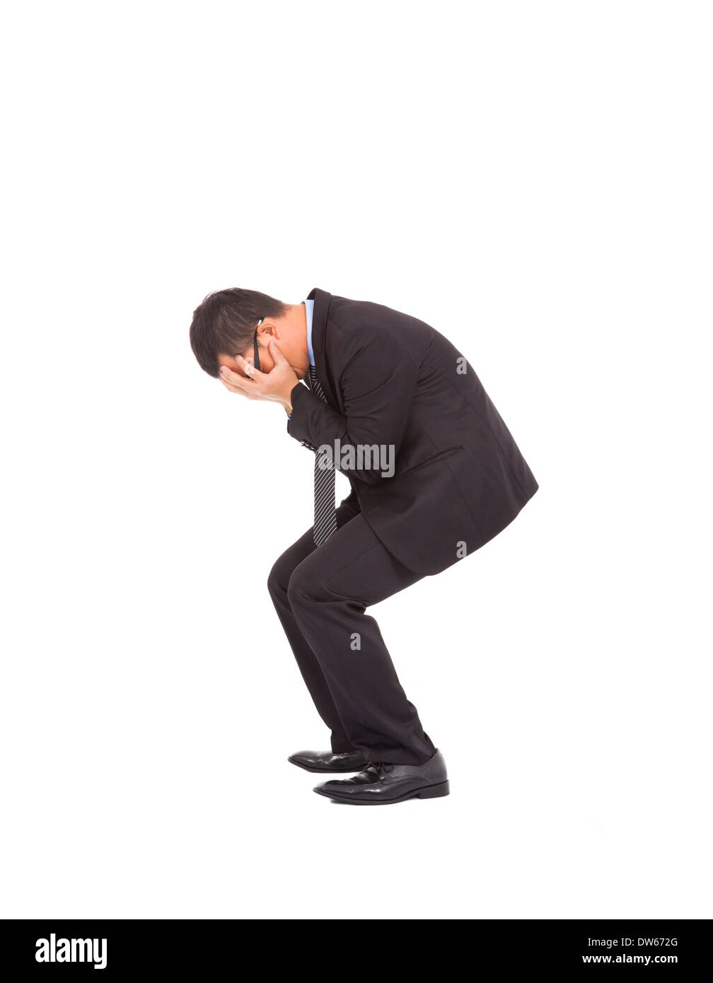 suffering businessman squat to feel disappointment ,helpless and crying Stock Photo