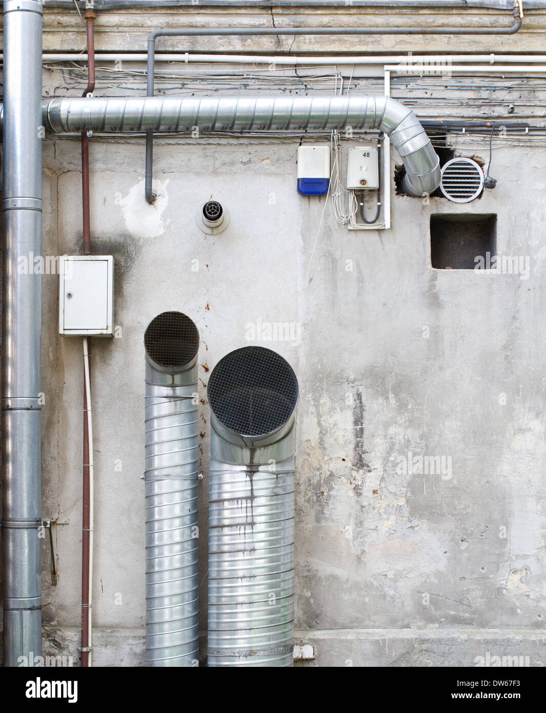 Pipes and wires on the wall. Stock Photo